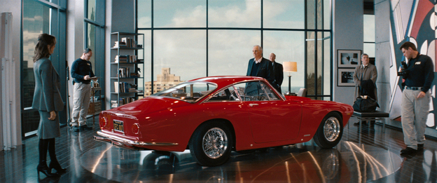 Seeing Red: Alan Alda (center, with Tea Leoni) and the Ferrari he keeps in his luxury-high-rise living room are the targets of both the payback plot and an FBI investigation.