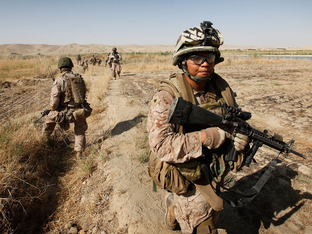 Cpl. Marcus Chischilly patrols in southern Afghanistan in October 2010. This photo was taken a day before he stepped on an explosive device and lost his left leg.