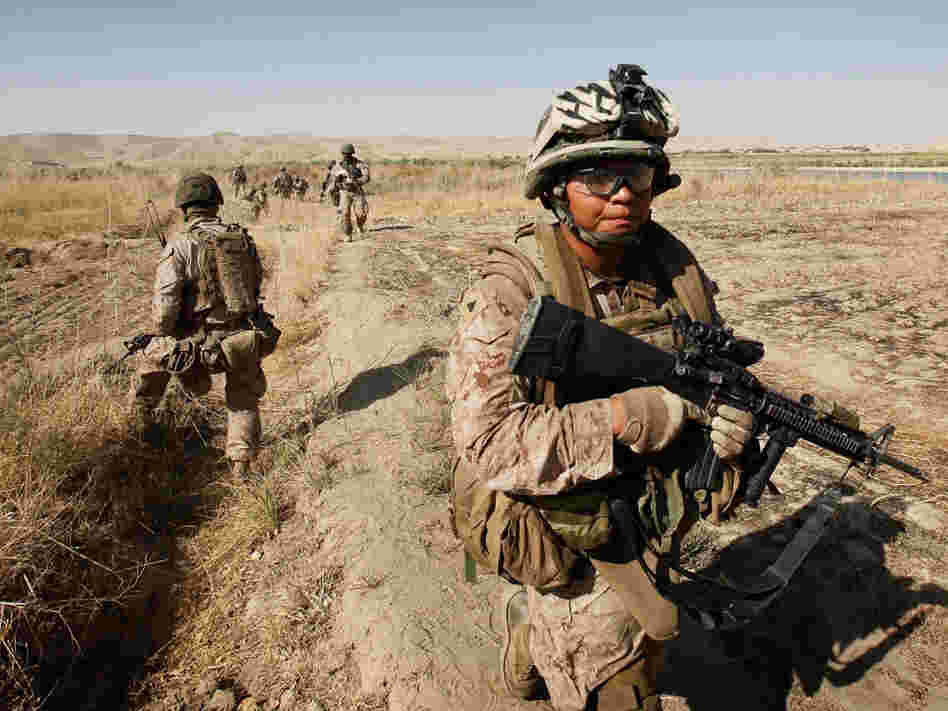 Cpl. Marcus Chischilly patrols in southern Afghanistan in October 2010. This photo was taken a day before he stepped on an explosive device and lost his left leg.