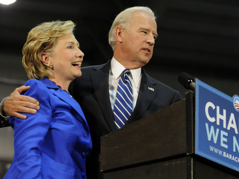 Democratic vice presidential candidate U.S. Senator Joe Biden (D-DE) (R) and U.S. Sen. Hillary Clinton (D-NY) (L) speak at a rally in support of then Democratic presidential nomineee U.S. Sen. Barack Obama (D-IL) on Oct. 11, 2008 in Scranton, Pennsylvania. 