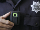 Officer Huy Nguyen shows a video camera worn by some officers in Oakland, Calif. Oakland and dozens of other police departments across the country are equipping officers with tiny body cameras to record anything from a traffic stop to a violent crime in progress. Officer Huy Nguyen shows a video camera worn by some officers in Oakland, Calif. Oakland and dozens of other police departments across the country are equipping officers with tiny body cameras to record anything from a traffic stop to a violent crime in progress.
