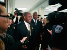 Tuesday: Republican presidential candidate Herman Cain is surrounded by police, body guards, staff members and journalists on Capitol Hill.