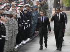 President Obama salutes service members from both sides of the Atlantic as he walks with French President Nicolas Sarkozy during the G-20 summit in Cannes, France, last week. President Obama salutes service members from both sides of the Atlantic as he walks with French President Nicolas Sarkozy during the G-20 summit in Cannes, France, last week.