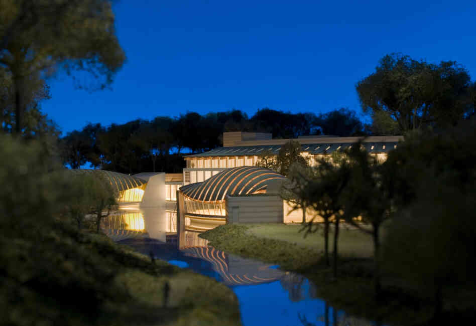  A model shows a view of the Crystal Bridges pavilion some museum staff refer to as "the armadillo" because of how its curved, copper bands resemble the animal's shell. 