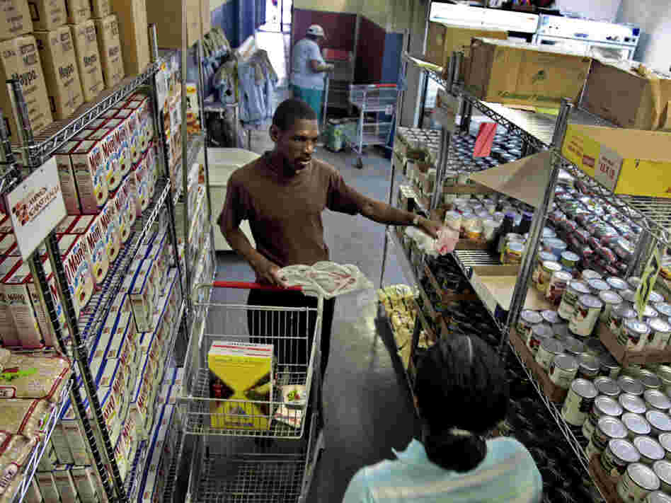 Joseph Byrd, unemployed and living on disability, prepares to pick up groceries at the Bed-Stuy Campaign Against Hunger food pantry in Brooklyn, N.Y., in 2010. The new experimental poverty measure takes into account cost of living associated with geographic differences.