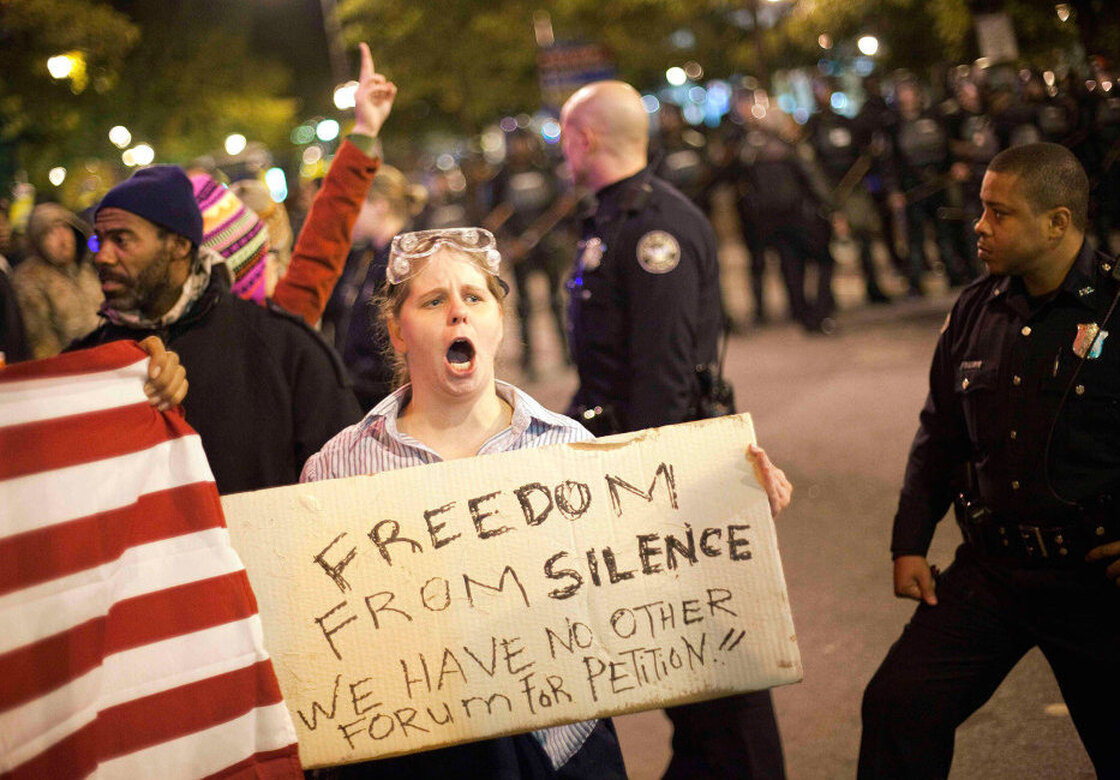 Amy Barnes protests as police move in to clear a downtown street during an Occupy Atlanta demonstration the first weekend in November.