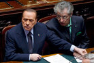 Italian Premier Silvio Berlusconi, left, holds the hand of Reforms Minister Umberto Bossi during a must-watched vote at the Lower Chamber, in Rome, Tuesday, Nov. 8, 2011. Italian Premier Silvio Berlusconi, left, holds the hand of Reforms Minister Umberto Bossi during a must-watched vote at the Lower Chamber, in Rome, Tuesday, Nov. 8, 2011.