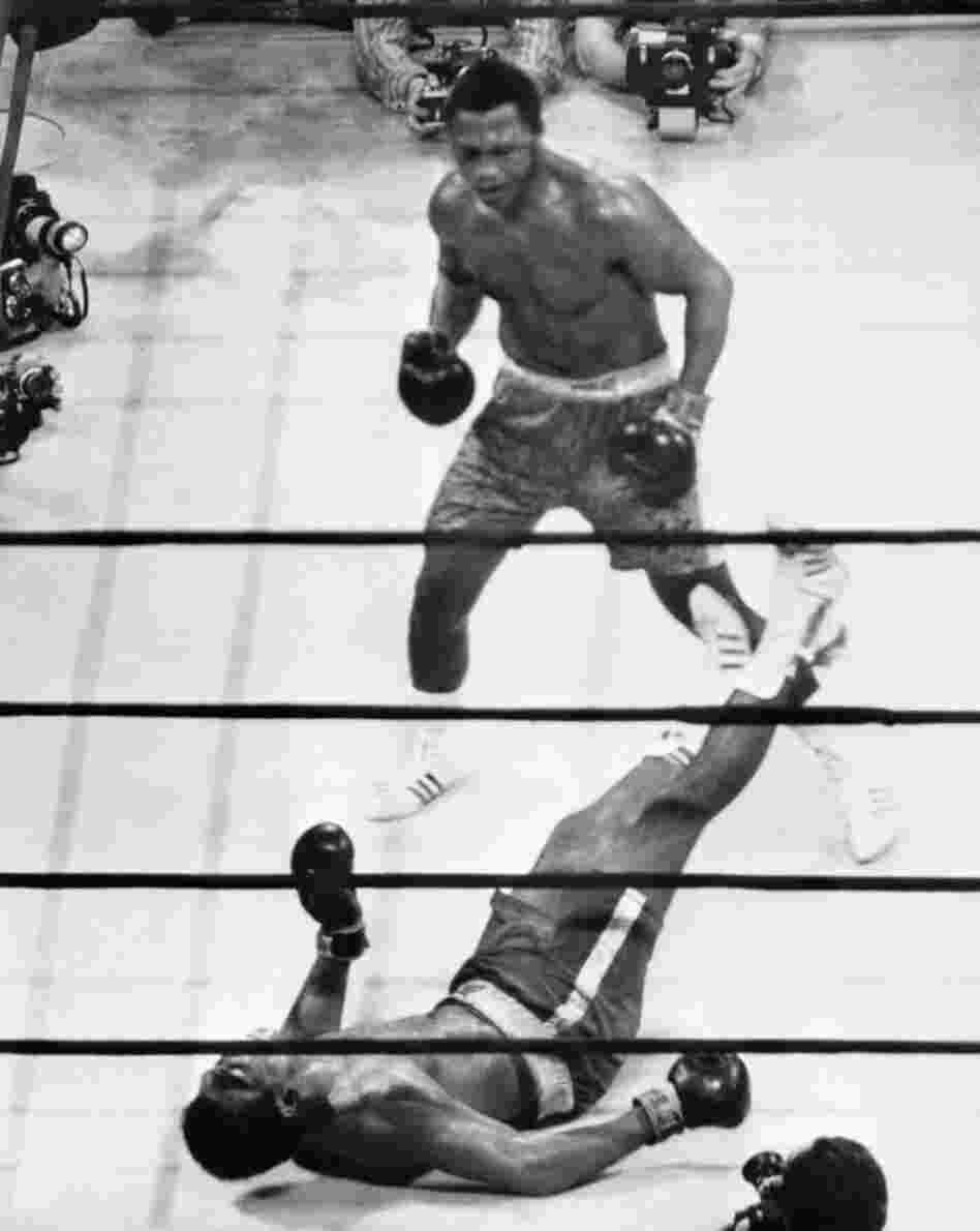 Down goes Ali: In the "Fight of the Century," on March 8, 1971, in Madison Square Garden, heavyweight champion Joe Frazier put Muhammad Ali on the canvas with a hard left hook. Frazier died Monday.