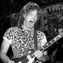 The fictional band from This Is Spinal Tap plays a real-life concert in 1984. Nigel Tufnel, the guitarist played by Christopher Guest, favored amplifiers whose volume could be cranked up to 11. The fictional band from This Is Spinal Tap plays a real-life concert in 1984. Nigel Tufnel, the guitarist played by Christopher Guest, favored amplifiers whose volume could be cranked up to 11.