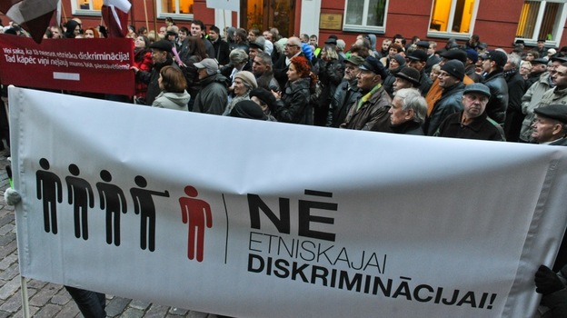In September, the pro-Russia Harmony Center party won parliamentary elections in Latvia. But the governing coalition has left the party on the sidelines. Supporters of the Harmony Center party protest in front of the Parliament building during its opening session in Riga on Oct. 17. The banner reads: In September, the pro-Russia Harmony Center party won parliamentary elections in Latvia. But the governing coalition has left the party on the sidelines. Supporters of the Harmony Center party protest in front of the Parliament building during its opening session in Riga on Oct. 17. The banner reads: