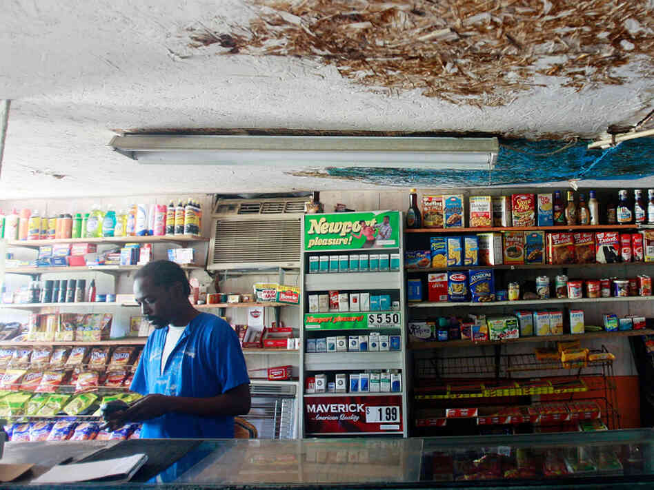 Garrett Grant works inside a store in the impoverished town of Glendora, Miss. Some 24 percent of Mississippians receive on government food assistance, the highest percentage in the country.
