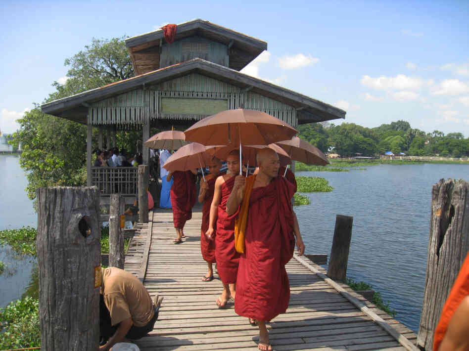 In largely Buddhist Myanmar, monks occupy a revered position in society and have often led anti-government protests. Here, monks walk along the U Bein Bridge in Amarapura, a former capital located just outside Mandalay.