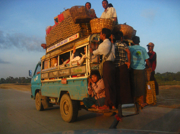Outside Mandalay, ordinary people crowd onto the most common form of transportation in Myanmar — private bus.