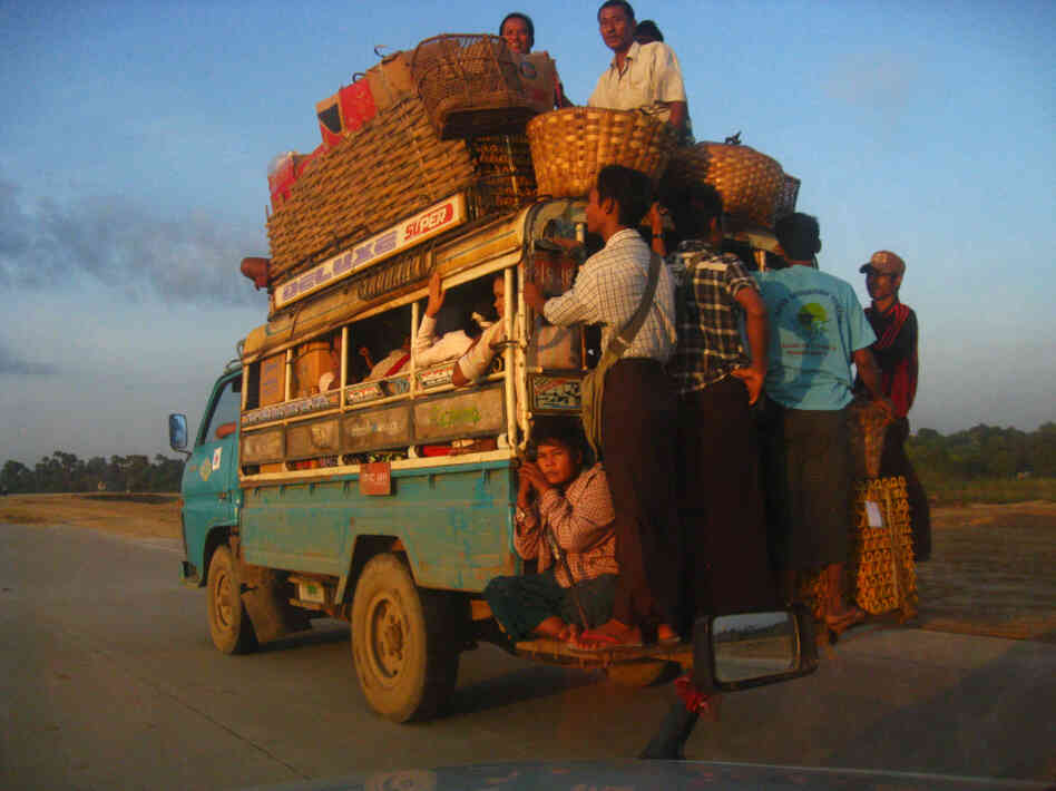 Outside Mandalay, ordinary people crowd onto the most common form of transportation in Myanmar — private bus.