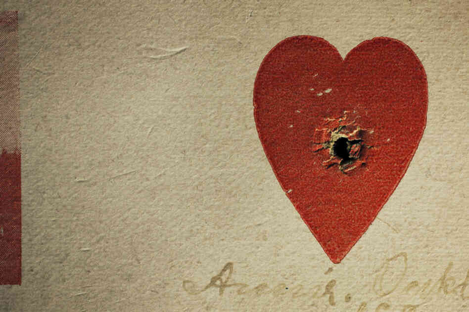 One of Annie Oakley's most popular stunts was shooting through the center of a small heart on a card.