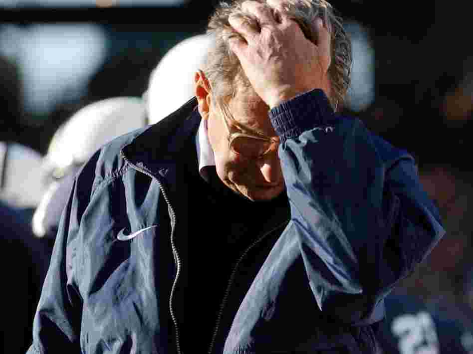 Penn State football coach Joe Paterno pauses on the sidelines during a game against Northwestern. Paterno's former assistant coach Jerry Sandusky has been accused of sexual abuse. 