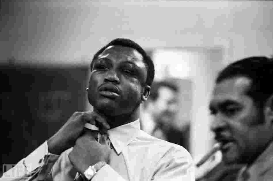 Ali. His face swollen and bruised, Frazier — stoic even in victory — makes himself presentable after defeating Ali.