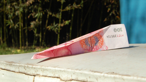 Last week, supporters delivered donations over the wall of Ai's compound in Beijing — 100 yuan notes folded into paper airplanes.