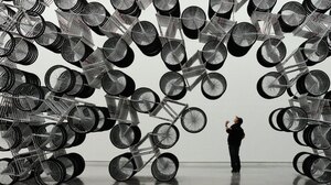 A man admires Forever Bicycles, a work by Ai Weiwei, at the Taipei Fine Art Museum last month.