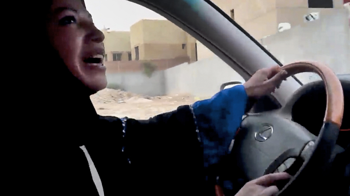 A Saudi woman drives a car in Riyadh in June as part of a campaign to defy the kingdom's ban on women driving. The image is from a video released by Change.org.