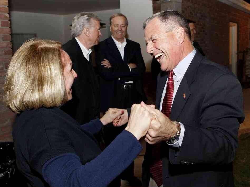 Apparent winner of Arizona state senate recall election, Jerry Lewis, with his sister, Pam Lewis Wessner, Tuesday, Nov. 8, 2011.