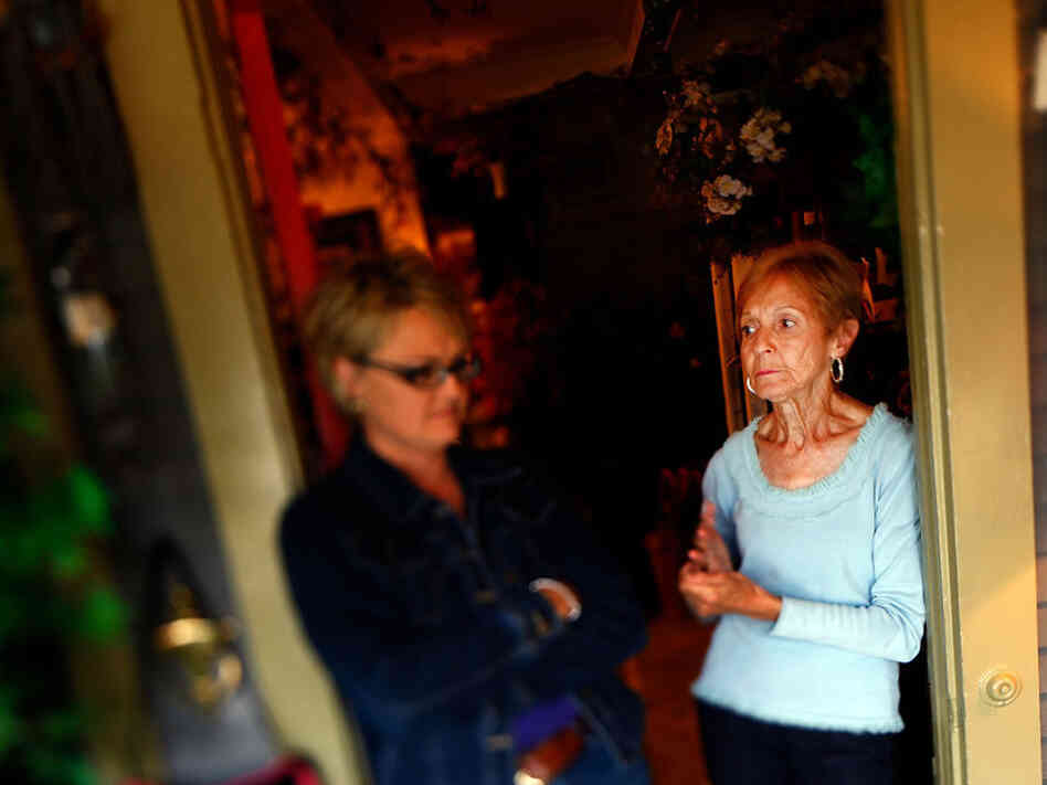 Selene Hummer, talks with her mother, Elsie Galemore, at her home-decorating shop in downtown Chanute, Kan.