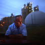 Jeff Galemore leans on his pickup truck near the Ash Grove Cement plant in Chanute, Kan. He and his family are concerned about the toxic emissions and are fighting for independent testing downwind. Jeff Galemore leans on his pickup truck near the Ash Grove Cement plant in Chanute, Kan. He and his family are concerned about the toxic emissions and are fighting for independent testing downwind.