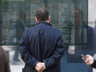 A man checks a stock exchange monitor outside a bank in Milan, Italy. Italy's key borrowing rate spiked Wednesday well above the 7 percent level that eventually forced other eurozone countries to seek bailouts. A man checks a stock exchange monitor outside a bank in Milan, Italy. Italy's key borrowing rate spiked Wednesday well above the 7 percent level that eventually forced other eurozone countries to seek bailouts.