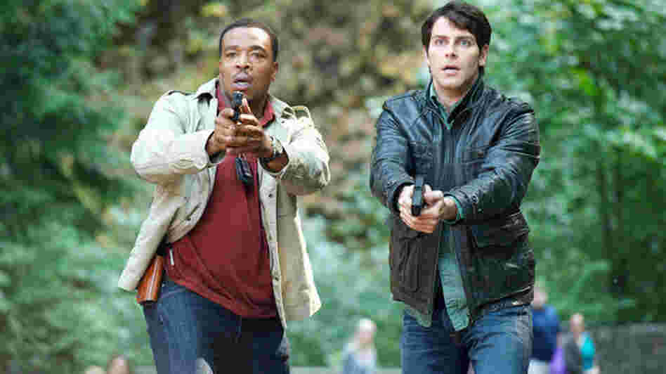 Russell Hornsby as Hank Griffin and David Giuntoli as Nick Burkhardt on NBC's Grimm.