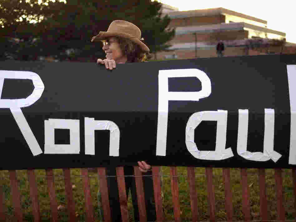 Sue McQueen displays her support for GOP presidential candidate Rep. Ron Paul outside the debate venue, Rochester, Mich., Nov. 9, 2011.