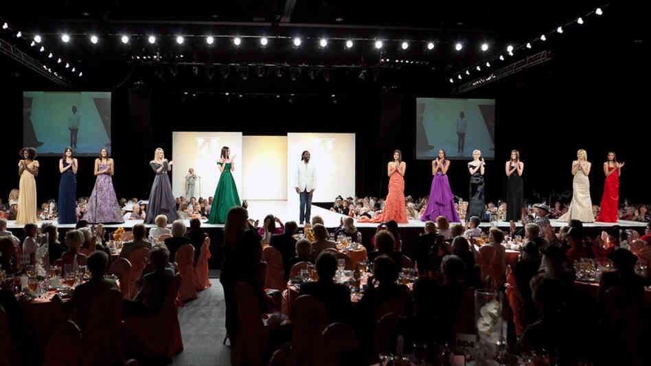 Kevan Hall stands with his models at the Frank Sinatra Fashion Show in February. The designer has dressed A-listers and won multiple awards. 