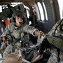 Army flight medics work on a Marine who was wounded by an improvised explosive device, or IED, in southern Afghanistan. Army flight medics work on a Marine who was wounded by an improvised explosive device, or IED, in southern Afghanistan.