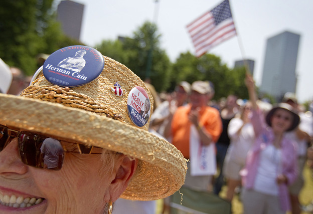 Supporters cheer at a rally as Cain announces his run for the Republican presidential nomination in Atlanta in May. 