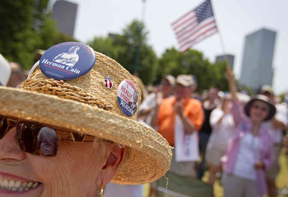 Supporters cheer at a rally as Cain announces his run for the Republican presidential nomination in Atlanta in May. 
