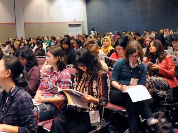 Women attend a talk on Wednesday at the Grace Hopper Celebration of Women in Computing in Portland, Ore. The conference offers mentoring and recruiting for women in technology fields. 