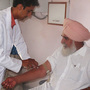 In a Healthpoint clinic in the village of Mallan in Punjab, India, lab technician Navdeep Sharma draws Suba Singh's blood sample. Part of Healthpoint's business plan is to offer cheap diagnostic tests at its clinics. Diagnosing and treating people in a single visit is one key to delivering affordable health care. In a Healthpoint clinic in the village of Mallan in Punjab, India, lab technician Navdeep Sharma draws Suba Singh's blood sample. Part of Healthpoint's business plan is to offer cheap diagnostic tests at its clinics. Diagnosing and treating people in a single visit is one key to delivering affordable health care.