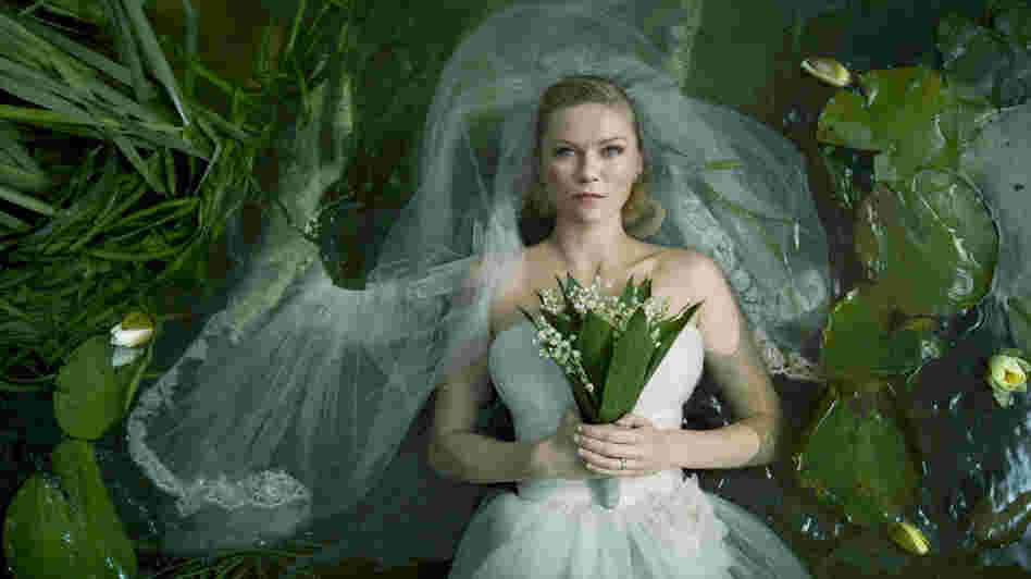 It's Oddly Easy Being Blue: Depressive newlywed Justine (Kirsten Dunst) finds herself oddly well equipped to face the end of humankind in Lars von Trier's Melancholia. It's Oddly Easy Being Blue: Depressive newlywed Justine (Kirsten Dunst) finds herself oddly well equipped to face the end of humankind in Lars von Trier's Melancholia.
