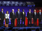 GOP presidential candidates (from left) former Pennsylvania Sen. Rick Santorum, Rep. Michele Bachmann, former House Speaker Newt Gingrich, former Massachusetts Gov. Mitt Romney, businessman Herman Cain, Texas Gov. Rick Perry, Rep. Ron Paul, and former Utah Gov. Jon Huntsman, pose before a GOP presidential debate at Oakland University in Auburn Hills, Mich., on Wednesday. GOP presidential candidates (from left) former Pennsylvania Sen. Rick Santorum, Rep. Michele Bachmann, former House Speaker Newt Gingrich, former Massachusetts Gov. Mitt Romney, businessman Herman Cain, Texas Gov. Rick Perry, Rep. Ron Paul, and former Utah Gov. Jon Huntsman, pose before a GOP presidential debate at Oakland University in Auburn Hills, Mich., on Wednesday.