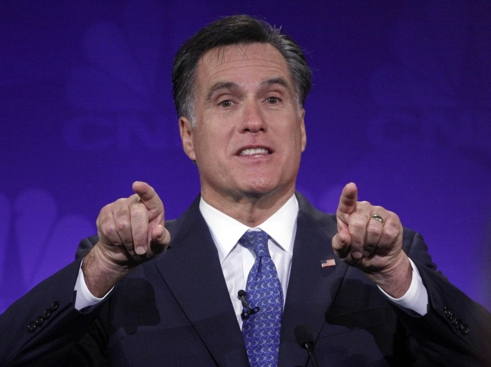 Mitt Romney gestures forcefully at the GOP presidential debate at Oakland University in Auburn Hills, Mich.,  Nov. 9, 2011. 