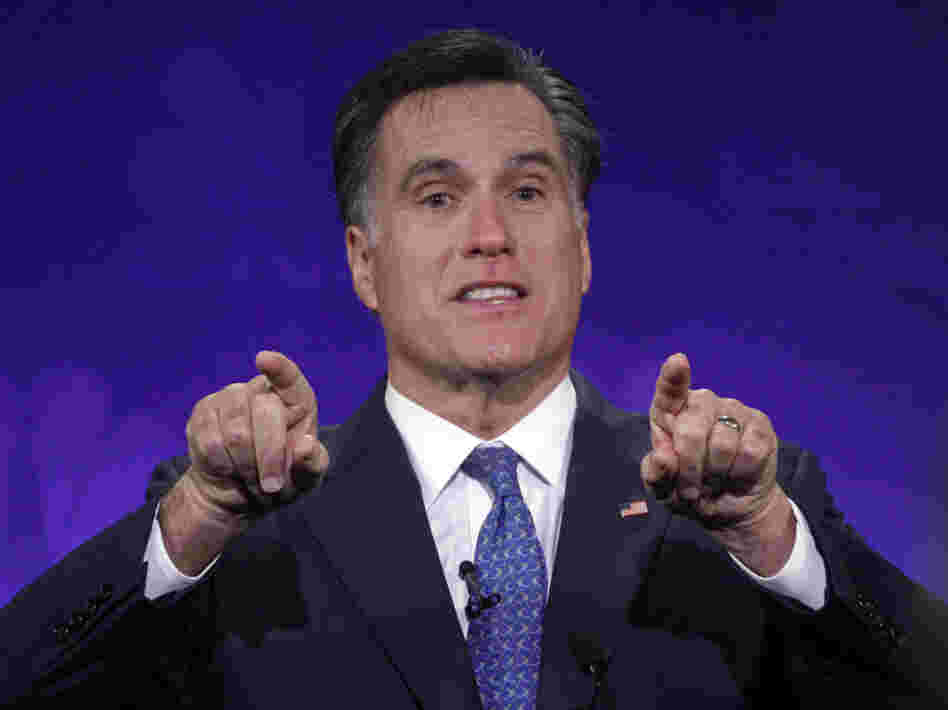 Mitt Romney gestures forcefully at the GOP presidential debate at Oakland University in Auburn Hills, Mich.,  Nov. 9, 2011. 
