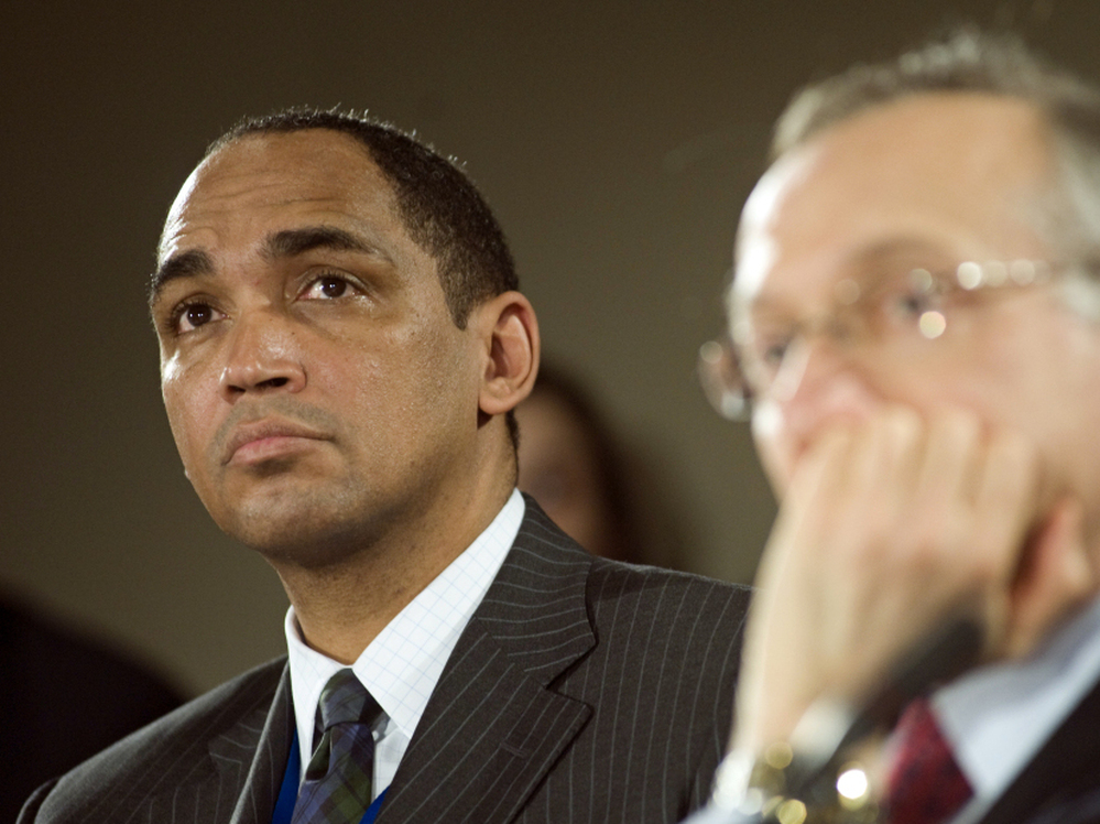 Wal-Mart's Dr. John Agwunobi (left) said in a statement that the company won't be "building a national, integrated, low-cost primary care health care platform." Even so, the leaves plenty of room  for the retailer to pursue an expansion of health care services at its stores.