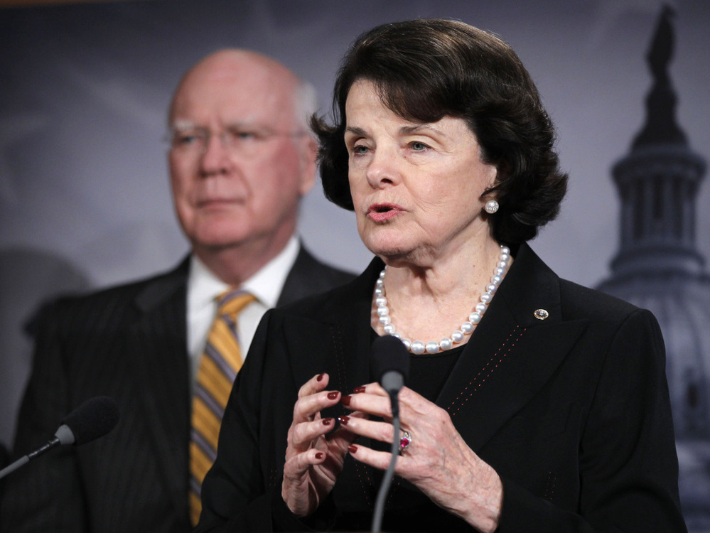Sen. Dianne Feinstein, D-Calif., accompanied by Senate Judiciary Committee Chairman Patrick Leahy, D-Vt., gestures during a news conference on Capitol Hill on Thursday to discuss committee action on legislation to repeal the Defense of Marriage Act.