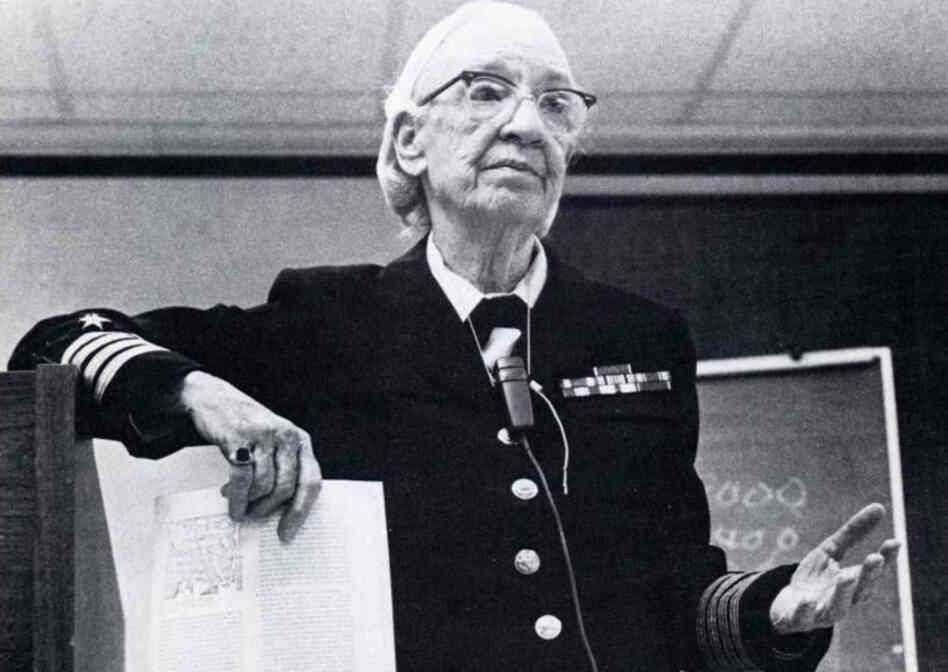 Grace Murray Hopper was a Navy rear admiral who in 1946 compiled a 500-page manual for the Harvard Mark I, one of the earliest programmable computers.  She developed the first compiler, which allowed programmers to code in their own language instead of rows of 1s and 0s, and later worked on computer languages.  