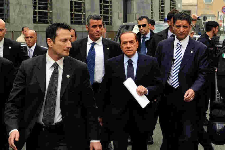 Berlusconi arrives at Milan's justice court before a legal hearing over allegations of fiscal fraud and breach of trust in his business interests, on May 2, 2011. 
