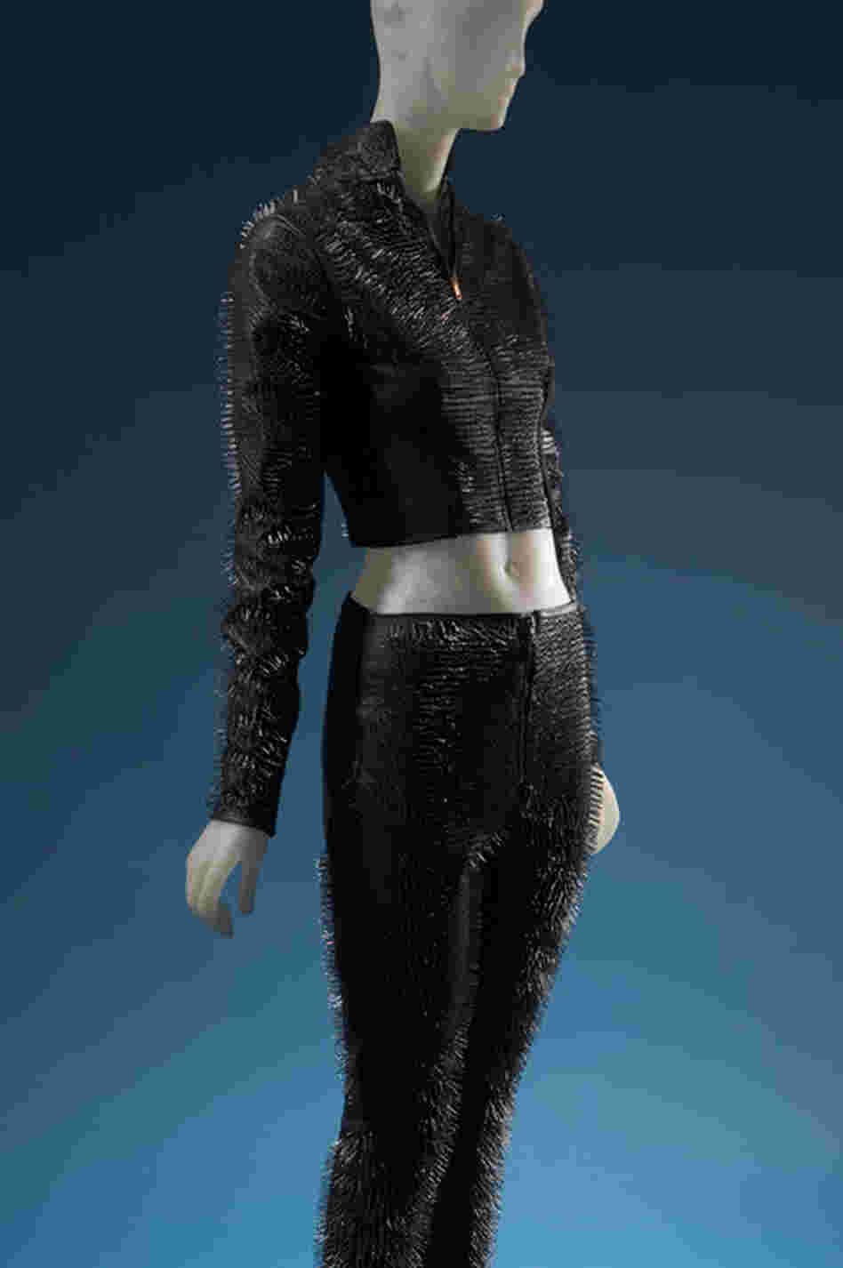 Covered in small, protruding nails, this leather ensemble by the young English designer Gareth Pugh is an example of the futuristic aesthetic Guinness favors. The style icon has supported several young couture designers over the years.