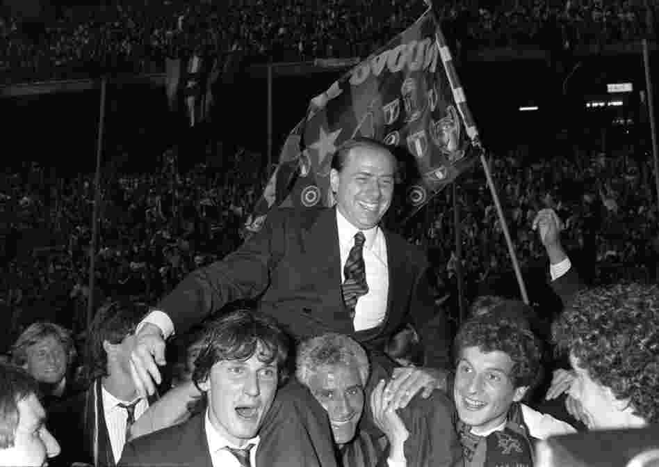 Berlusconi, then and still owner of football club AC Milan, is carried by Milan players after the team won the 1988 Italian soccer championship. 