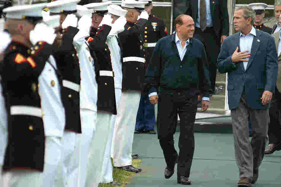 U.S. President George W. Bush (R) walks with former Italian Prime Minister Silvio Berlusconi after Berlusconi's arrival for a meeting at Camp David in 2002. The two leaders met to discuss the situation in Iraq.  