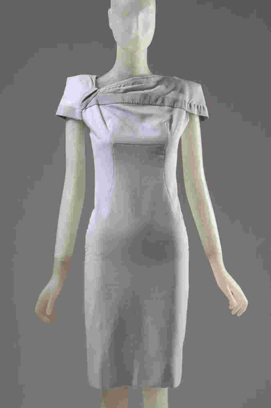 Guinness is not just a collector of couture; she also creates it. This original Guinness design in gray showcases the fashion icon's love of uniforms.