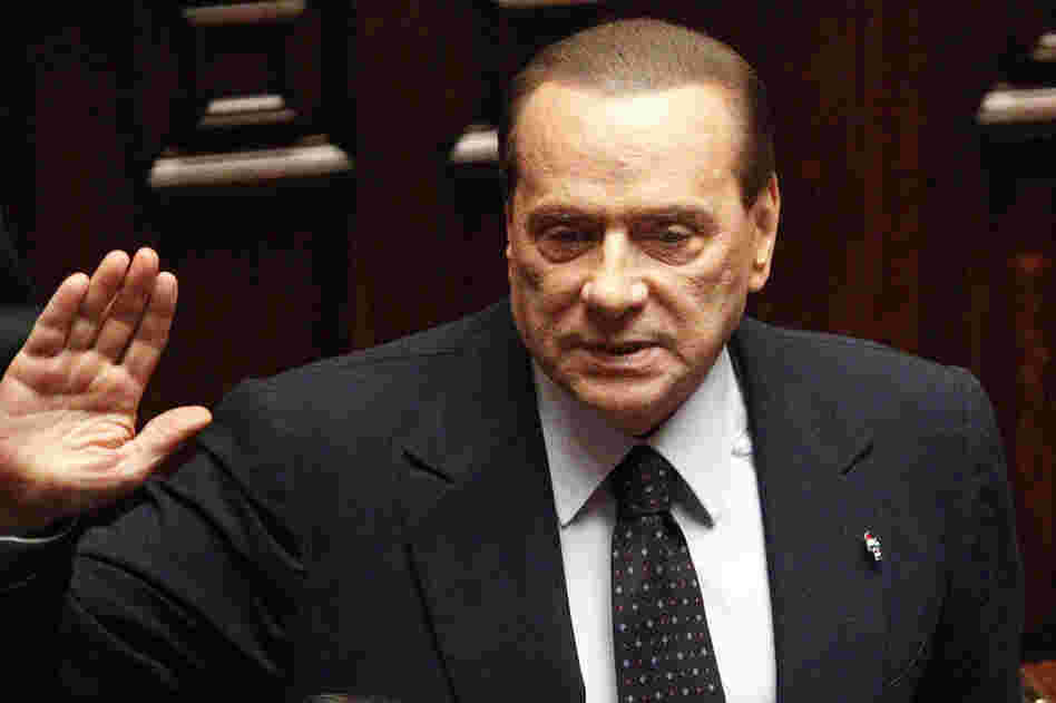 Italian Premier Silvio Berlusconi acknowledges applause before leaving parliament's lower chamber in Rome on Nov. 12. The lower chamber passed European-demanded reforms aimed at bringing Italy back from the brink of economic crisis. Berlusconi said he would resign once the reforms were passed. 