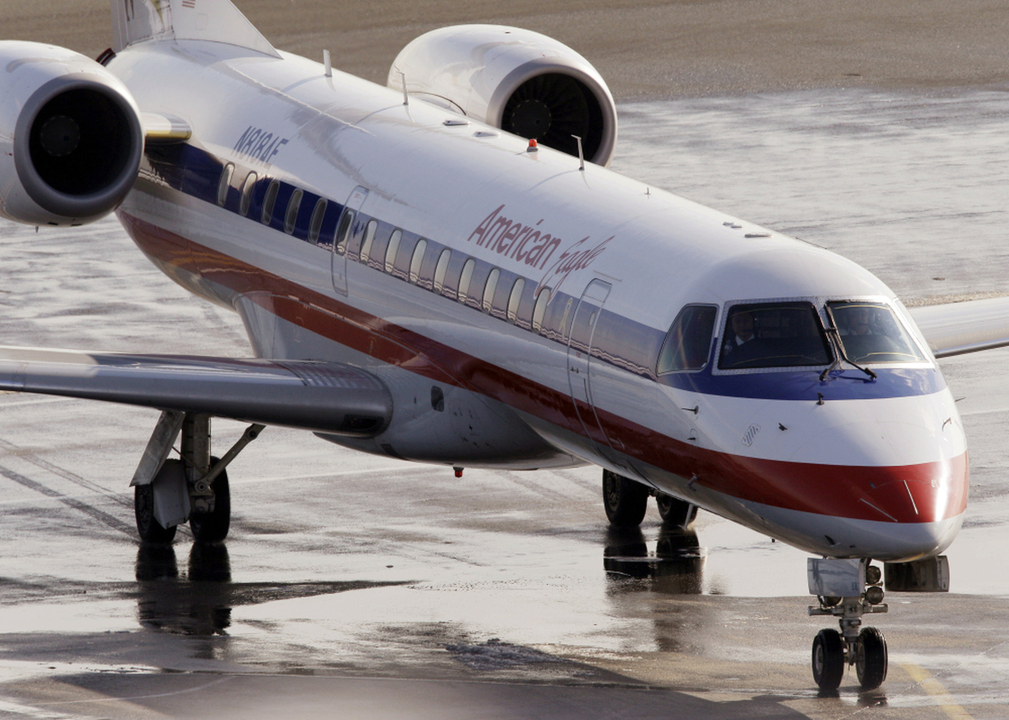 In this January 2011 file photo, an American Eagle jet taxis at Boston's Logan International Airport. 